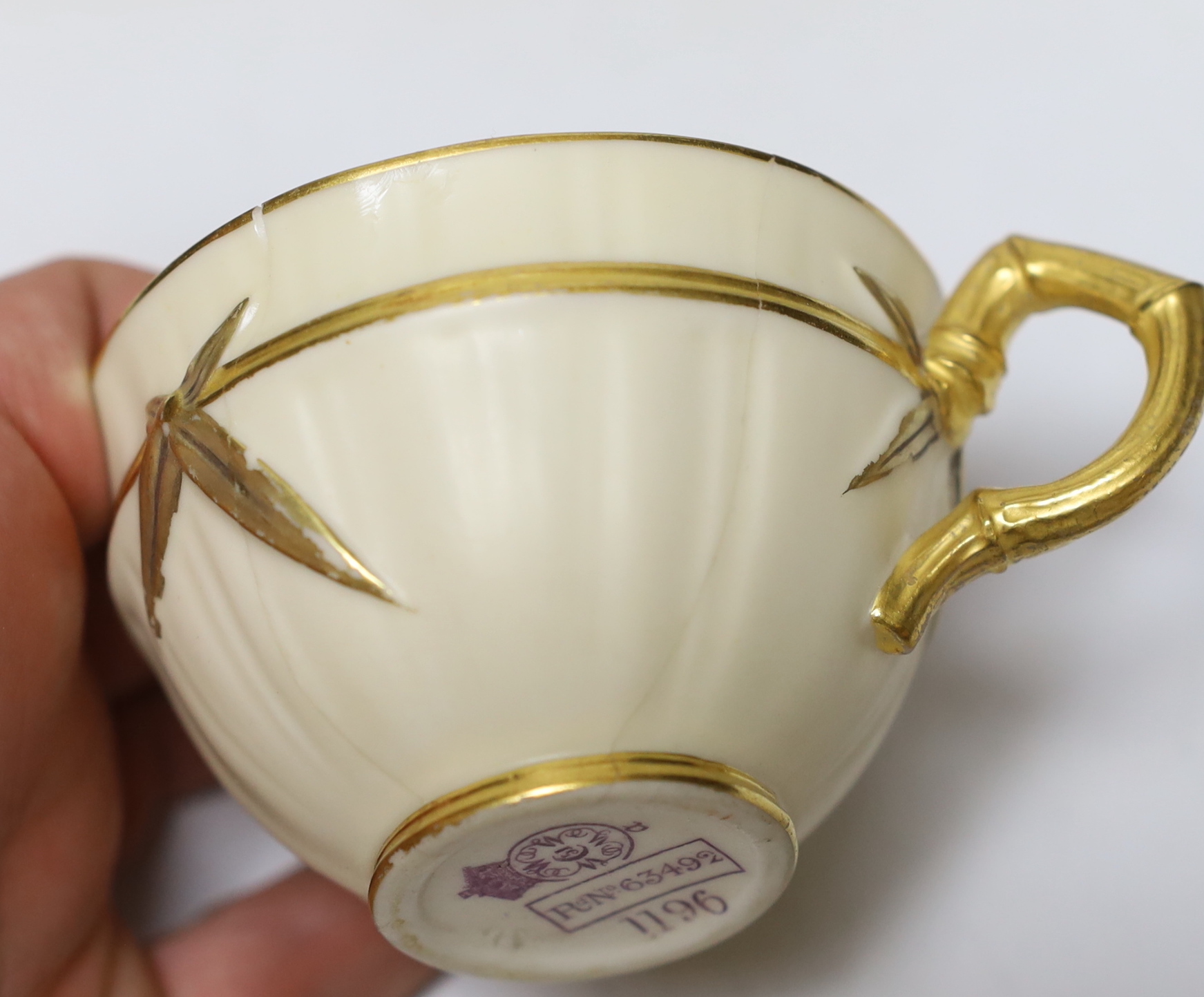 A late 19th century Royal Worcester ivory ground and gilt decorated cabaret set, tray 37cm in diameter
